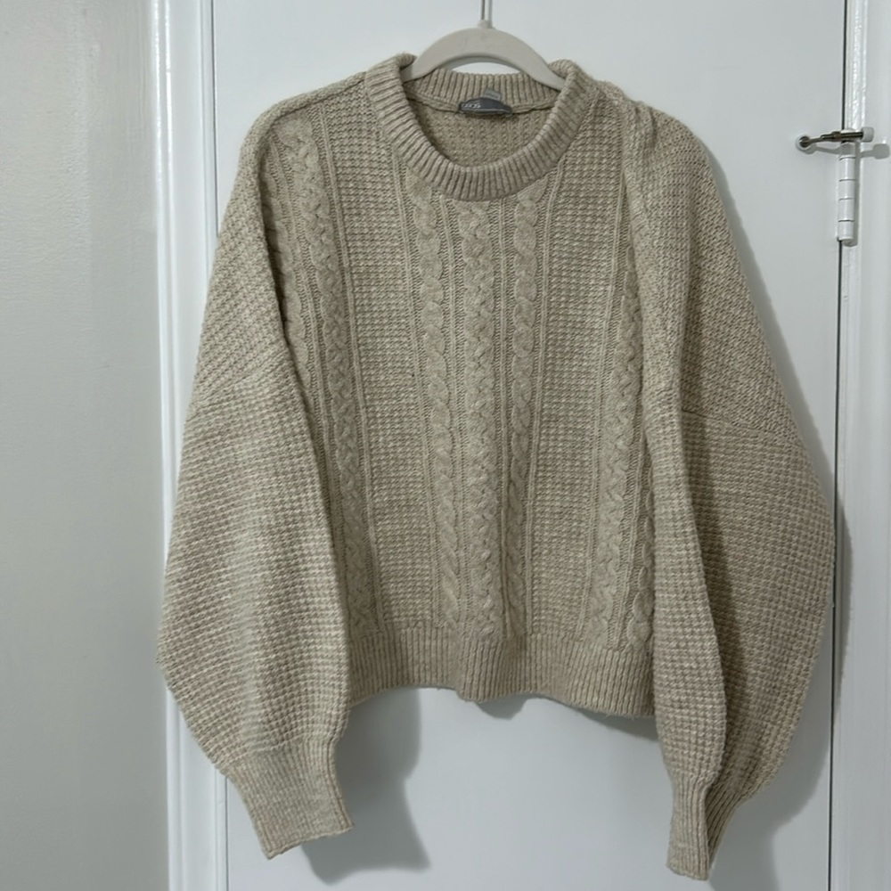 Knit slightly oversized sweater.